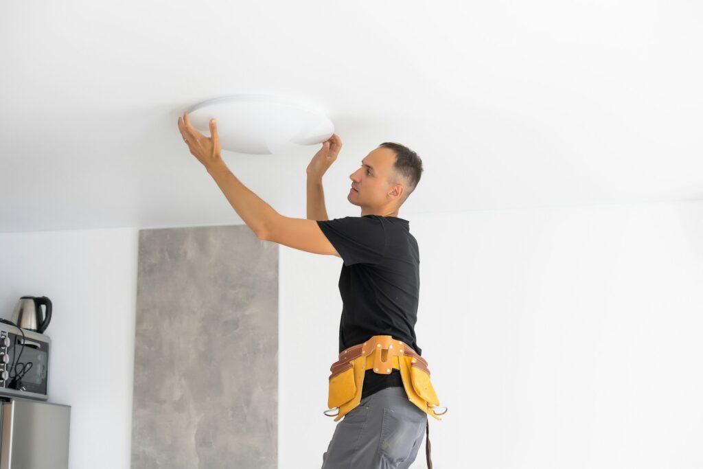 electrician fixing light