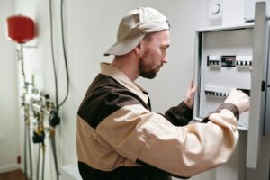 electrician working on electric panel